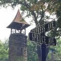 Street Sign with Bell Tower in Background